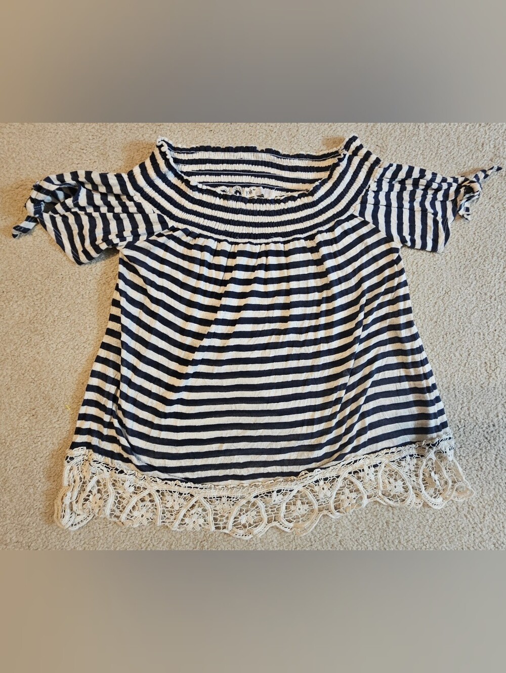 Jolt off-the-shoulder top features a casual, bohemian aesthetic Nautical